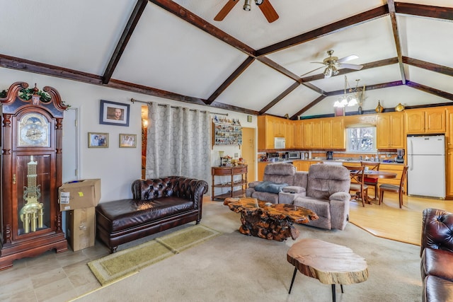 living room featuring vaulted ceiling and ceiling fan with notable chandelier