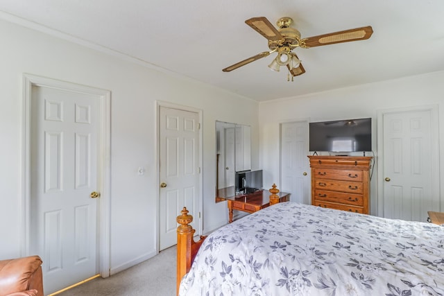 bedroom featuring crown molding, light colored carpet, and ceiling fan