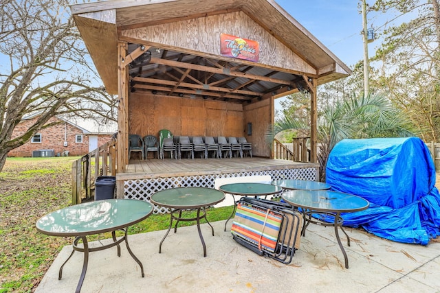 view of patio featuring central air condition unit and a wooden deck