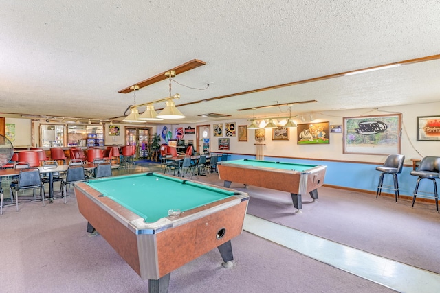 game room featuring billiards and a textured ceiling