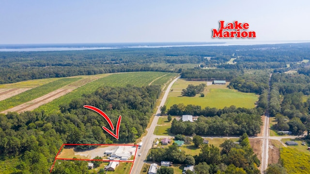 birds eye view of property featuring a rural view