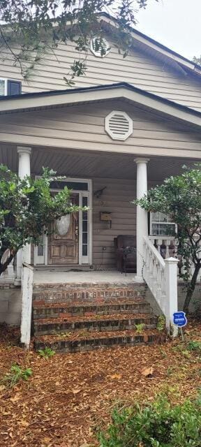 doorway to property with a porch