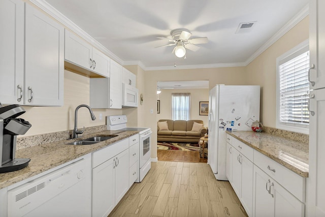 kitchen with light hardwood / wood-style flooring, white appliances, ceiling fan, white cabinetry, and sink