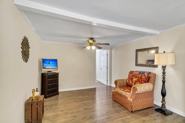 living area with hardwood / wood-style floors, ceiling fan, and beam ceiling