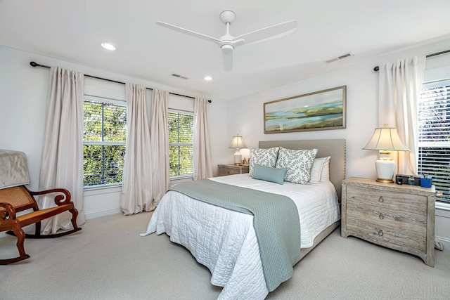 bedroom with recessed lighting, light colored carpet, visible vents, and ceiling fan