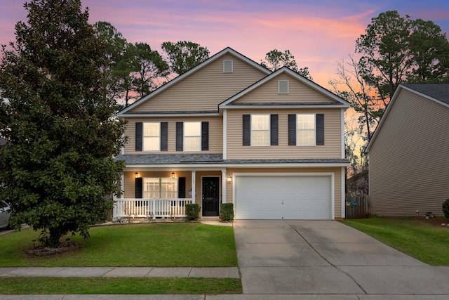 traditional home featuring driveway, an attached garage, a porch, and a lawn