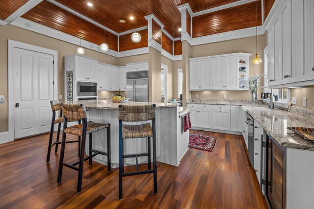 kitchen featuring a sink, open shelves, dark wood finished floors, built in appliances, and wood ceiling