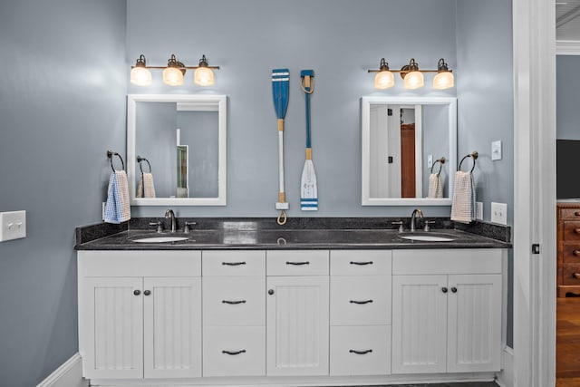 bathroom featuring double vanity and a sink