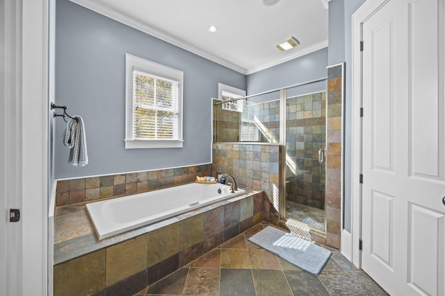 bathroom with a bath, a shower stall, stone tile flooring, and ornamental molding