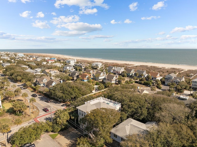 birds eye view of property with a residential view, a water view, and a beach view