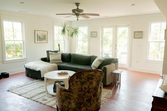 living room featuring a wealth of natural light and ceiling fan