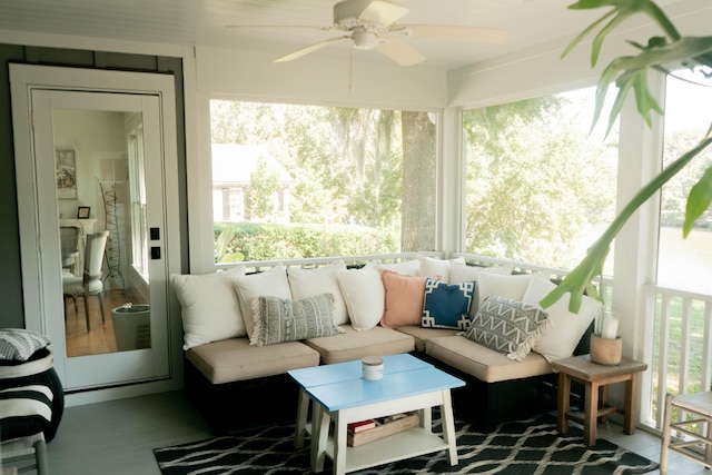 sunroom with ceiling fan and a wealth of natural light