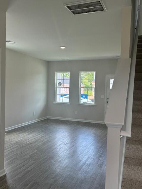 interior space with dark hardwood / wood-style flooring