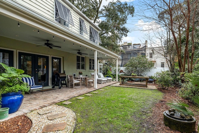 view of yard featuring ceiling fan and a patio area