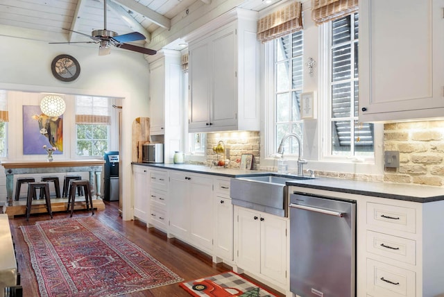 kitchen featuring white cabinetry, sink, backsplash, and dishwasher