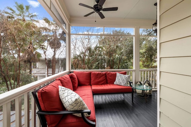 sunroom featuring ceiling fan