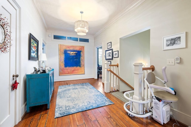 foyer entrance with hardwood / wood-style flooring and ornamental molding