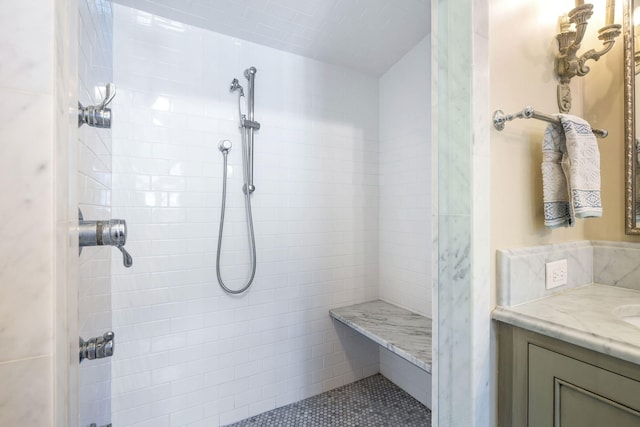 bathroom featuring vanity and a tile shower