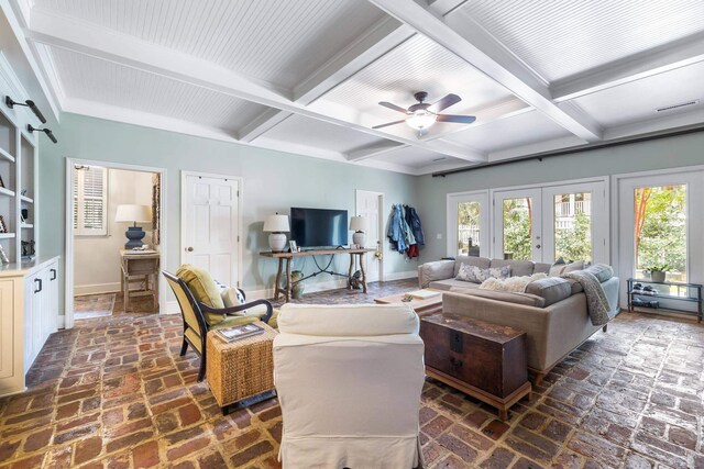 living room featuring french doors, ceiling fan, and beam ceiling