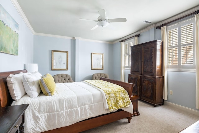 bedroom featuring ornamental molding, light colored carpet, and ceiling fan