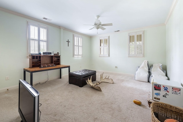 interior space with ornamental molding, light carpet, and ceiling fan