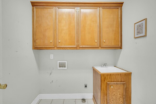 laundry room with cabinet space, baseboards, washer hookup, and electric dryer hookup