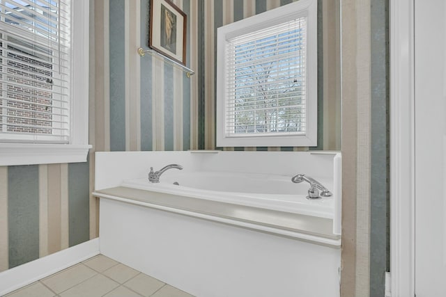 full bathroom featuring wallpapered walls, tile patterned flooring, and a garden tub