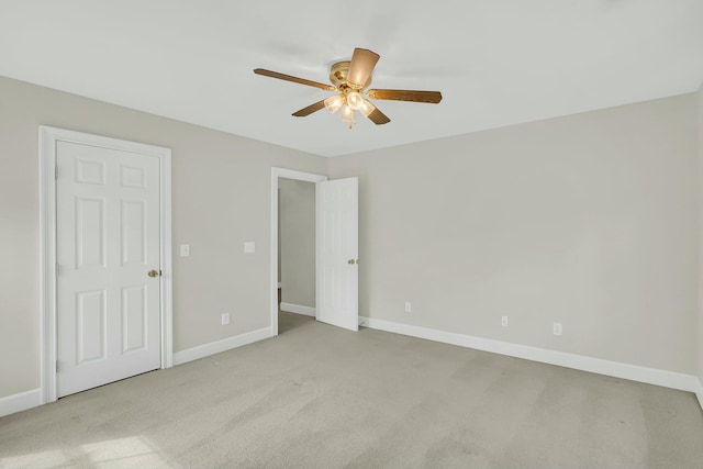 unfurnished bedroom with carpet, baseboards, and a ceiling fan