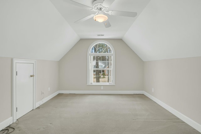 bonus room featuring carpet floors, baseboards, vaulted ceiling, and a ceiling fan