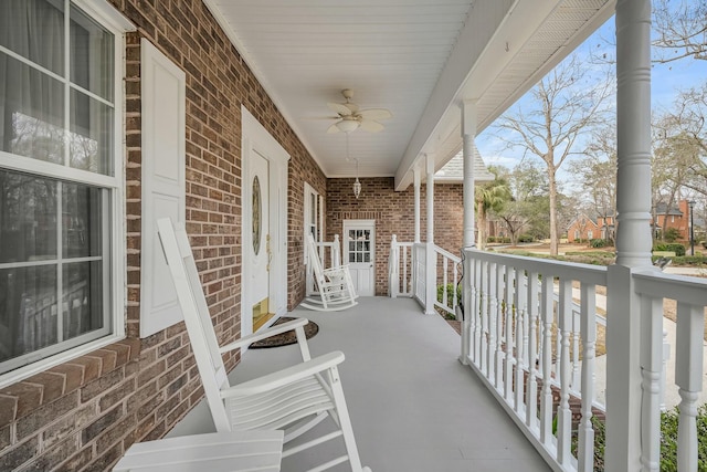 balcony featuring a porch and a ceiling fan