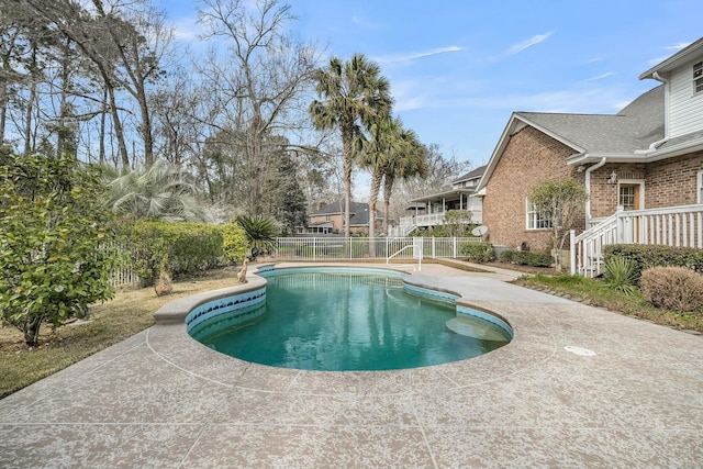 view of swimming pool with fence, a fenced in pool, and a patio