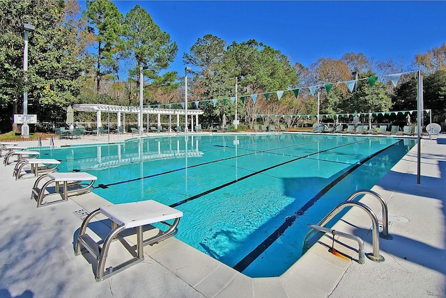 pool featuring a patio area and a pergola