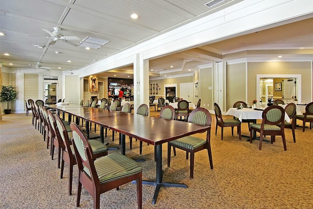 dining area with light carpet, a ceiling fan, crown molding, and recessed lighting