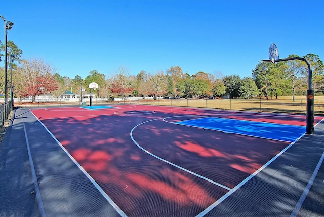 view of sport court featuring community basketball court and fence