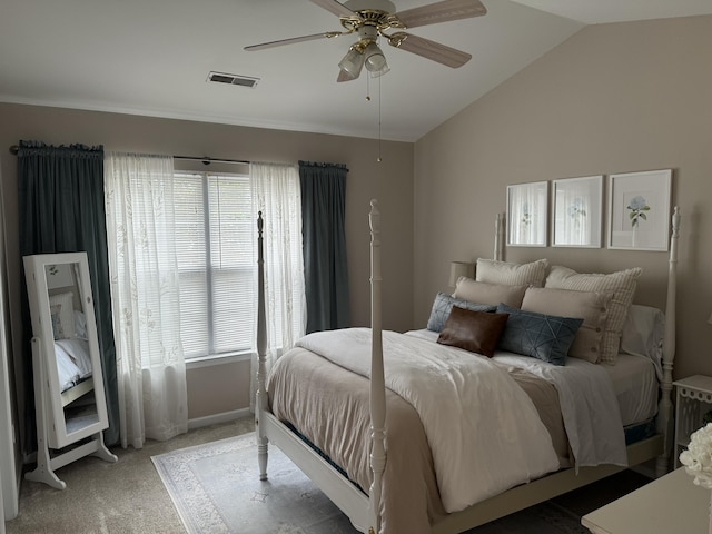 bedroom with lofted ceiling, carpet, multiple windows, and visible vents