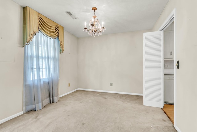 131 Wedgewood Cir, Goose Creek, SC 29445 - spare room featuring light carpet and a chandelier