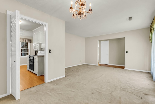 131 Wedgewood Cir, Goose Creek, SC 29445 - spare room featuring light carpet and a chandelier