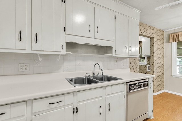 131 Wedgewood Cir, Goose Creek, SC 29445 - kitchen with white dishwasher, light countertops, decorative backsplash, light wood finished floors, and white cabinets