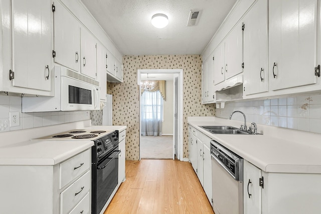 131 Wedgewood Cir, Goose Creek, SC 29445 - kitchen featuring white appliances, light wood-style floors, white cabinetry, light countertops, and wallpapered walls