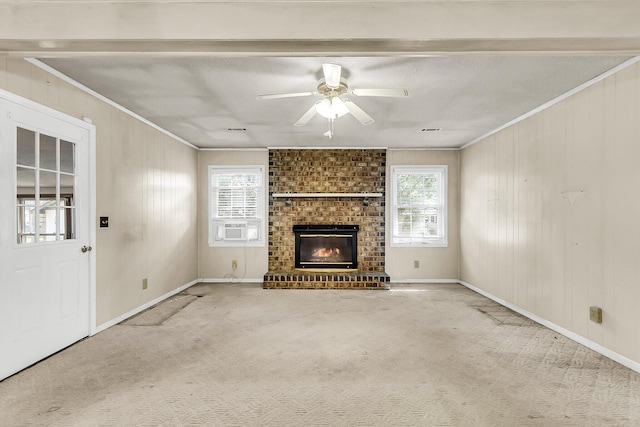 131 Wedgewood Cir, Goose Creek, SC 29445 - unfurnished living room featuring ornamental molding, carpet, a fireplace, ceiling fan, and wooden walls
