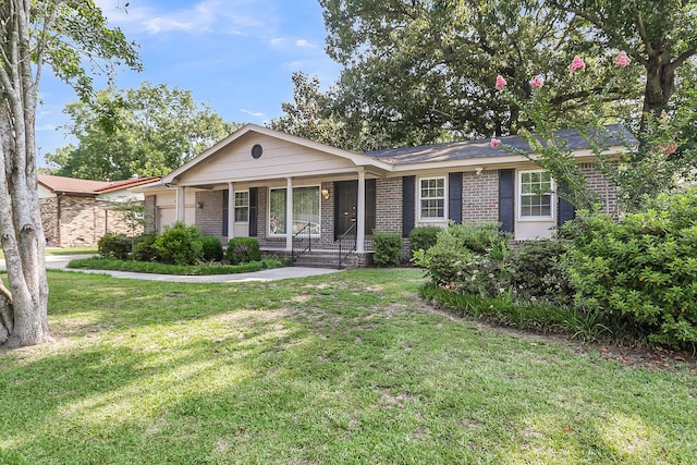 131 Wedgewood Cir, Goose Creek, SC 29445 - ranch-style house with brick siding, a front yard, and a porch