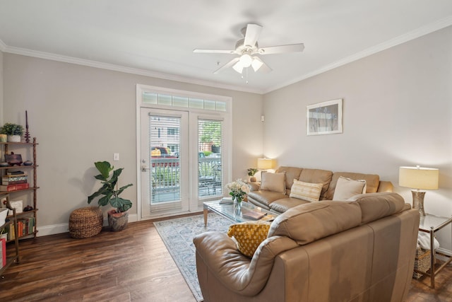 living area with crown molding, baseboards, ceiling fan, and wood finished floors