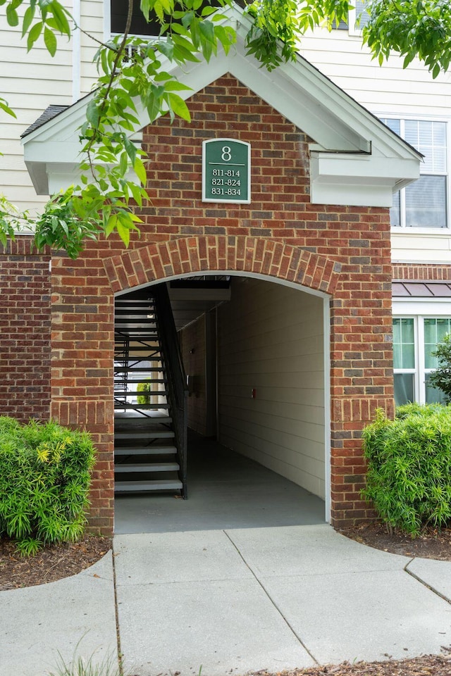 entrance to property with brick siding