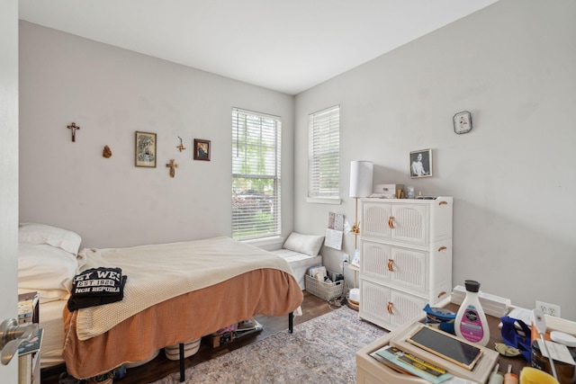 bedroom featuring wood finished floors