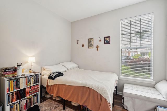 bedroom featuring wood finished floors
