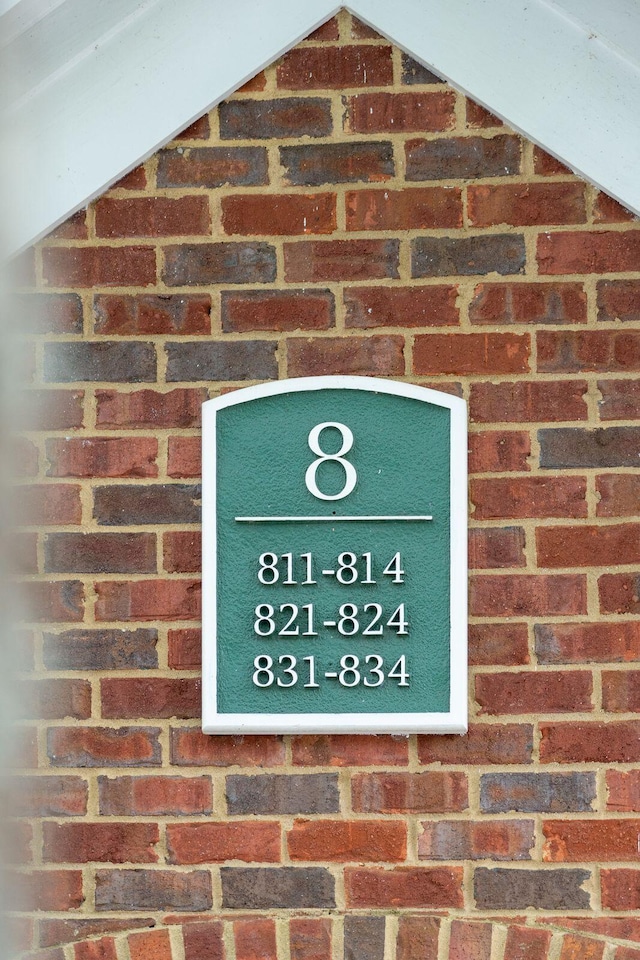 exterior details featuring brick siding
