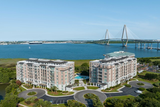 bird's eye view of apartment complex, a large body of water, and a notable bridge
