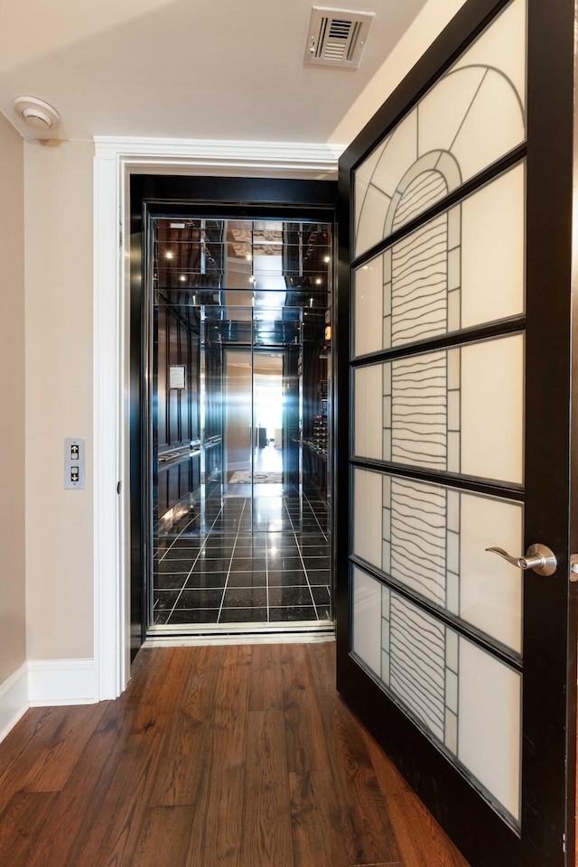 detailed view of baseboards and wood finished floors