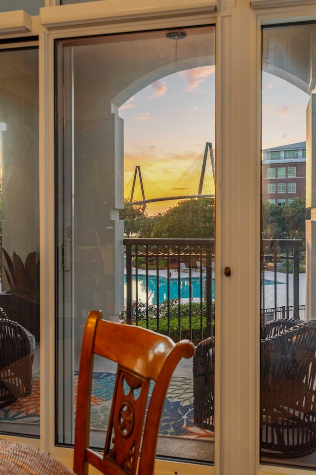 doorway to outside with healthy amount of natural light and arched walkways