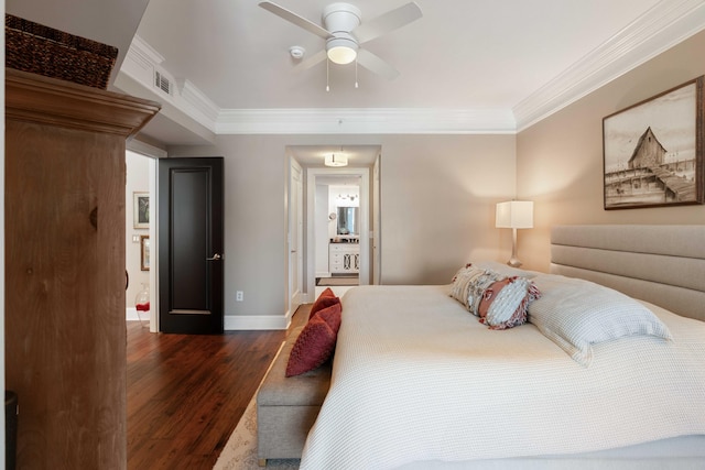 bedroom with dark wood-style floors, crown molding, baseboards, connected bathroom, and a ceiling fan